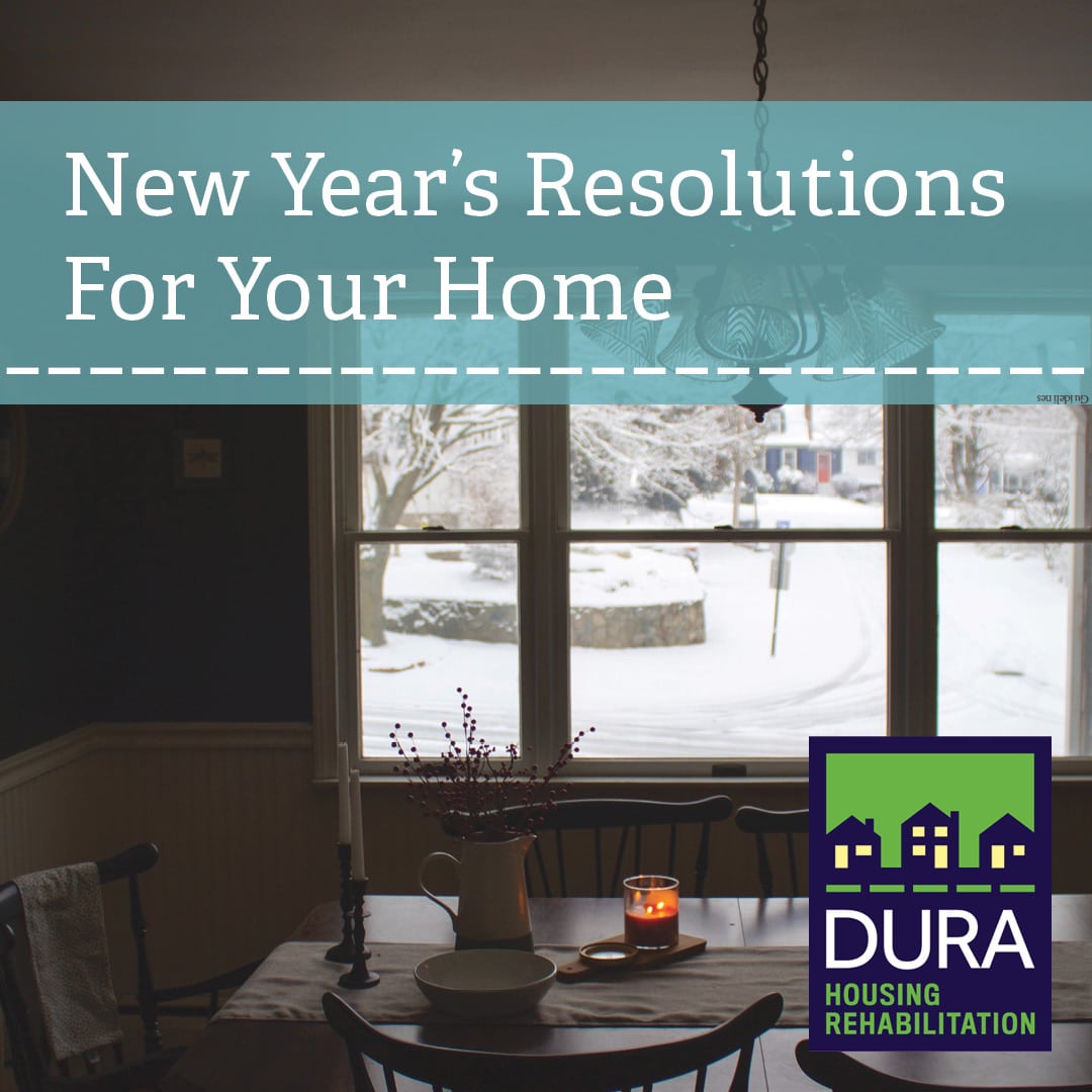 A kitchen window on a snowy day, text overlay reads "New Year's Resolutions For Your Home"