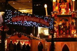 Christkindlmarket sign surrounded by christmas lights